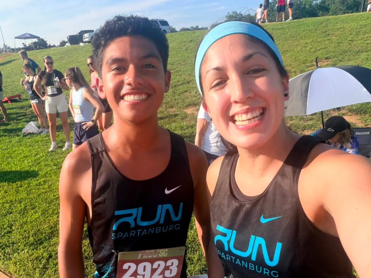 Two Run Spartanburg runners smiling after a race